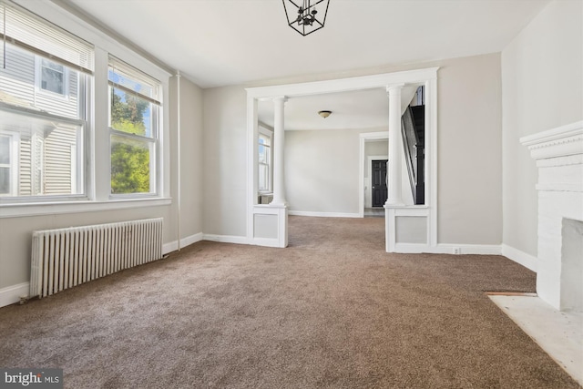 4011 Hayward Ave, Baltimore, MD 21215 - unfurnished living room featuring radiator, a fireplace, ornate columns, carpet floors, and baseboards