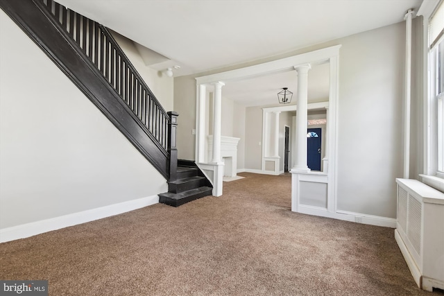 4011 Hayward Ave, Baltimore, MD 21215 - interior space with radiator, carpet, ornate columns, stairway, and baseboards