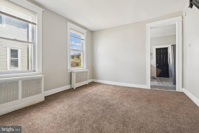 4011 Hayward Ave, Baltimore, MD 21215 - carpeted spare room featuring radiator heating unit and baseboards