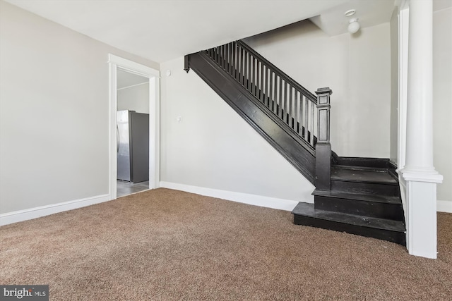 4011 Hayward Ave, Baltimore, MD 21215 - staircase featuring carpet flooring, baseboards, and ornate columns