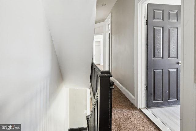 4011 Hayward Ave, Baltimore, MD 21215 - corridor with carpet flooring, baseboards, and an upstairs landing