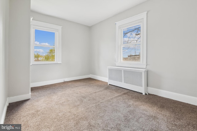 4011 Hayward Ave, Baltimore, MD 21215 - carpeted empty room with baseboards and radiator