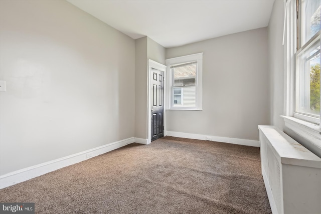 4011 Hayward Ave, Baltimore, MD 21215 - carpeted empty room with baseboards