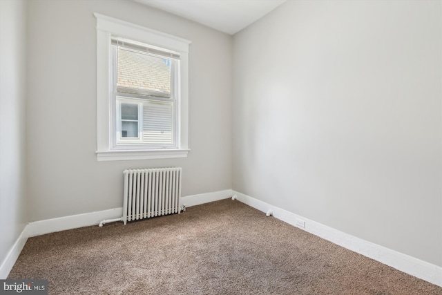 4011 Hayward Ave, Baltimore, MD 21215 - carpeted spare room with baseboards and radiator