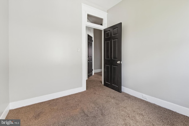 4011 Hayward Ave, Baltimore, MD 21215 - carpeted empty room with baseboards