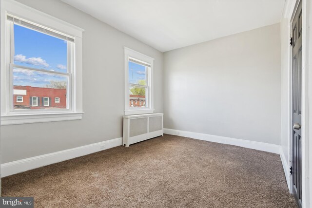 4011 Hayward Ave, Baltimore, MD 21215 - unfurnished room with radiator heating unit, carpet, and baseboards