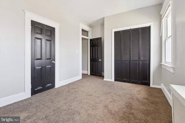 4011 Hayward Ave, Baltimore, MD 21215 - unfurnished bedroom featuring carpet floors, baseboards, and a closet