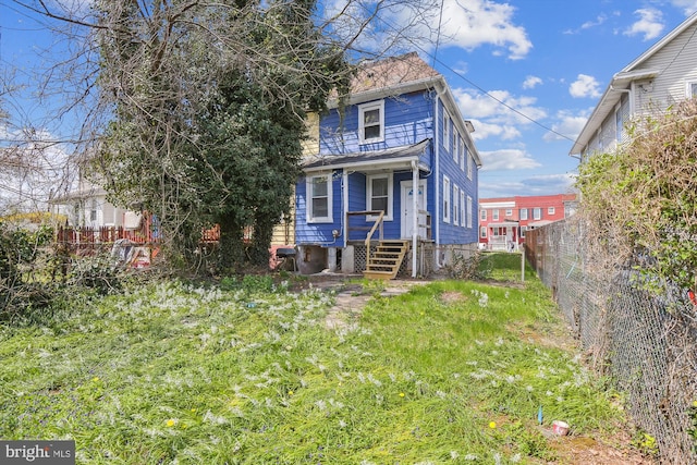 4011 Hayward Ave, Baltimore, MD 21215 - view of front facade featuring fence
