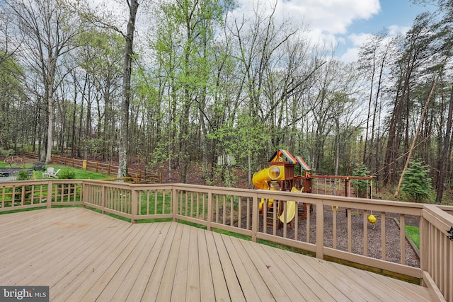 wooden terrace featuring a playground