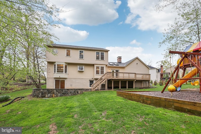 rear view of property featuring a chimney, a yard, a playground, and stairs