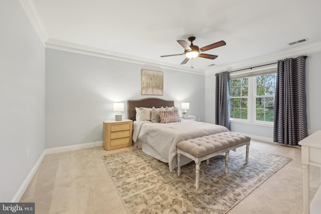 bedroom featuring baseboards, crown molding, visible vents, ceiling fan, and light colored carpet