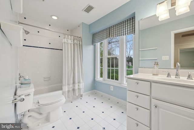 full bath featuring visible vents, shower / tub combo, baseboards, toilet, and vanity