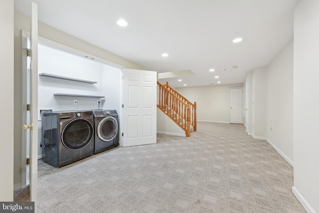 clothes washing area featuring baseboards, recessed lighting, separate washer and dryer, and laundry area