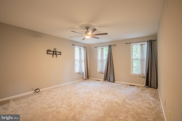 2409 Wood Stream Ct, Ellicott City, MD 21042 - spare room with ceiling fan, baseboards, and light colored carpet