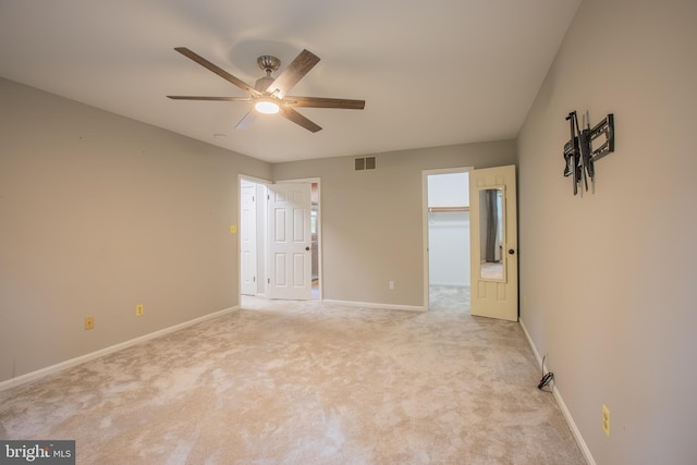 2409 Wood Stream Ct, Ellicott City, MD 21042 - unfurnished bedroom with baseboards, light carpet, ceiling fan, and a spacious closet