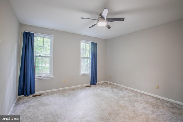 2409 Wood Stream Ct, Ellicott City, MD 21042 - carpeted spare room featuring a ceiling fan and baseboards