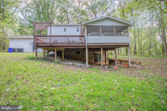 2409 Wood Stream Ct, Ellicott City, MD 21042 - back of property featuring a wooden deck, a sunroom, and a lawn