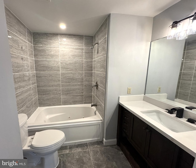 bathroom featuring vanity, toilet, a combined bath / shower with jetted tub, and tile patterned floors