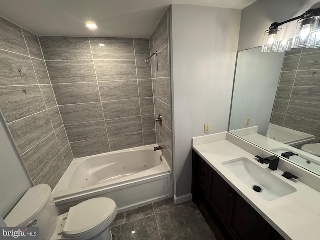 bathroom with vanity, toilet, a combined bath / shower with jetted tub, and tile patterned floors