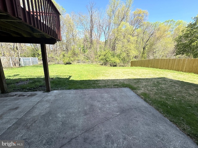 view of yard featuring fence and a patio area