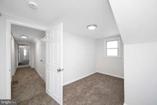 bonus room featuring baseboards, visible vents, and carpet floors