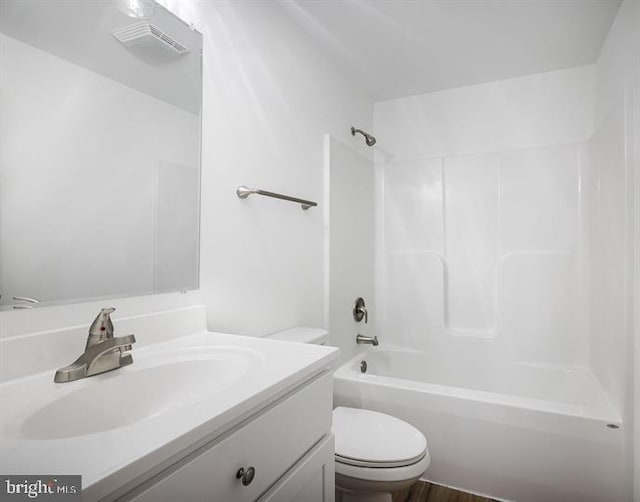 Sugar Hollow Rd, Berkeley Springs, WV 25411 - bathroom featuring visible vents, toilet, wood finished floors, vanity, and shower / bathtub combination