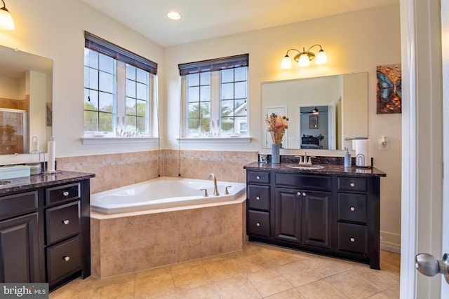 bathroom with a stall shower, recessed lighting, tile patterned flooring, a garden tub, and vanity