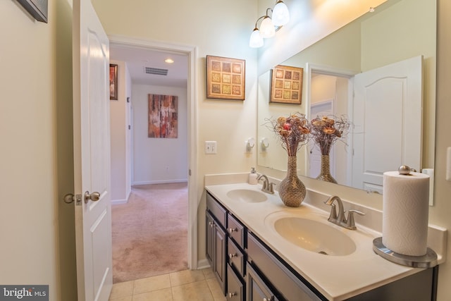 full bath featuring tile patterned floors, visible vents, a sink, and double vanity
