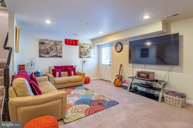 living area with baseboards, recessed lighting, visible vents, and carpet