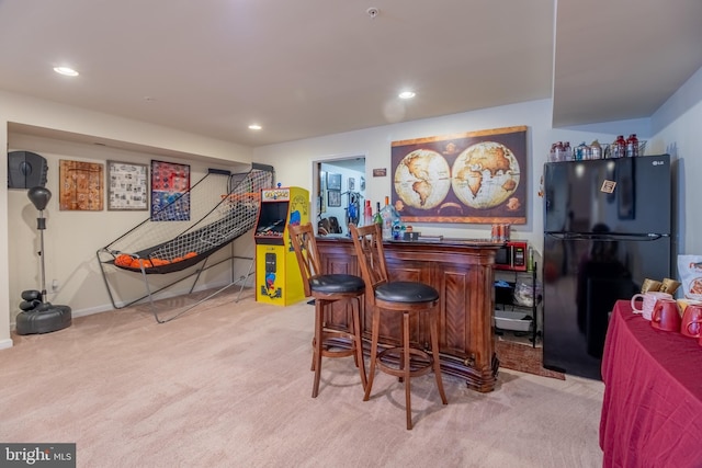 bar featuring carpet, recessed lighting, a dry bar, and freestanding refrigerator