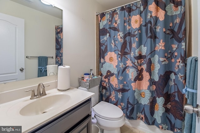 bathroom with toilet, vanity, a shower with shower curtain, and visible vents