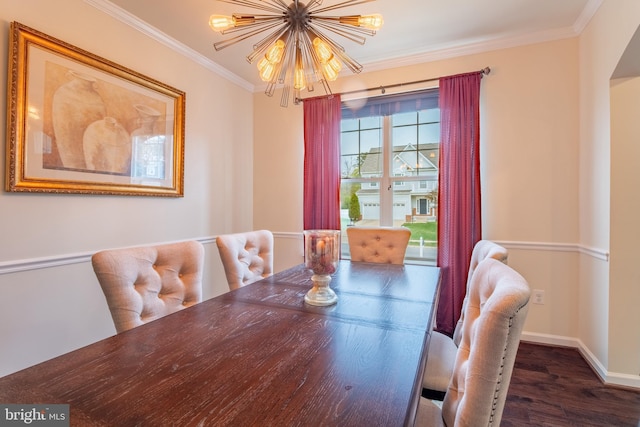 dining area featuring baseboards, wood finished floors, an inviting chandelier, and ornamental molding