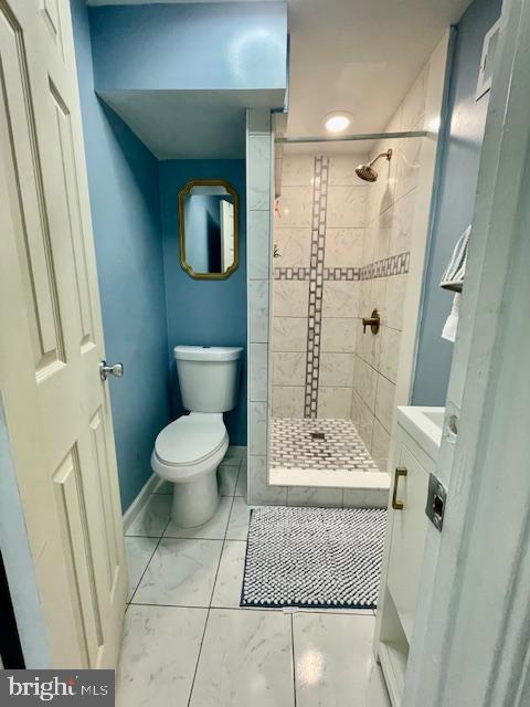 704 Pritchard Ln, Upper Marlboro, MD 20774 - full bathroom with a stall shower, baseboards, marble finish floor, and toilet