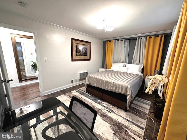 14427 Seneca Rd, Germantown, MD 20874 - bedroom with ornamental molding, wood finished floors, and baseboards
