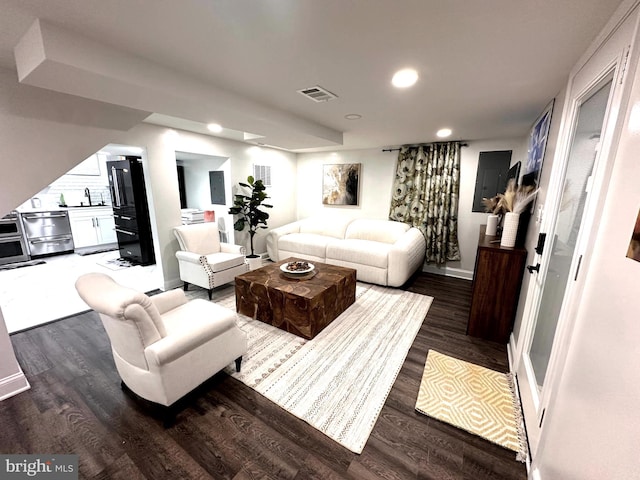 14427 Seneca Rd, Germantown, MD 20874 - living room with dark wood-type flooring, recessed lighting, baseboards, and electric panel