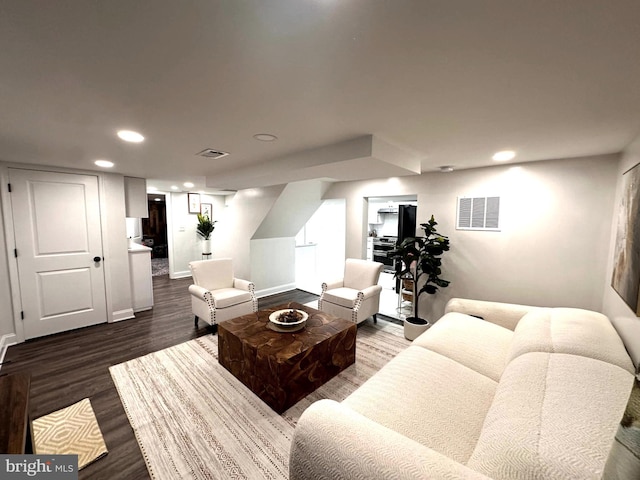14427 Seneca Rd, Germantown, MD 20874 - living room with dark wood-style flooring, recessed lighting, and baseboards