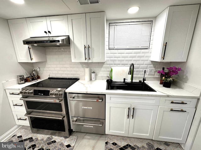 14427 Seneca Rd, Germantown, MD 20874 - kitchen with double oven range, range hood, a sink, white cabinets, and recessed lighting