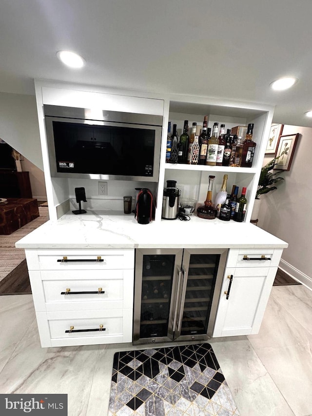 14427 Seneca Rd, Germantown, MD 20874 - indoor dry bar with wine cooler, light marble finish floors, and recessed lighting