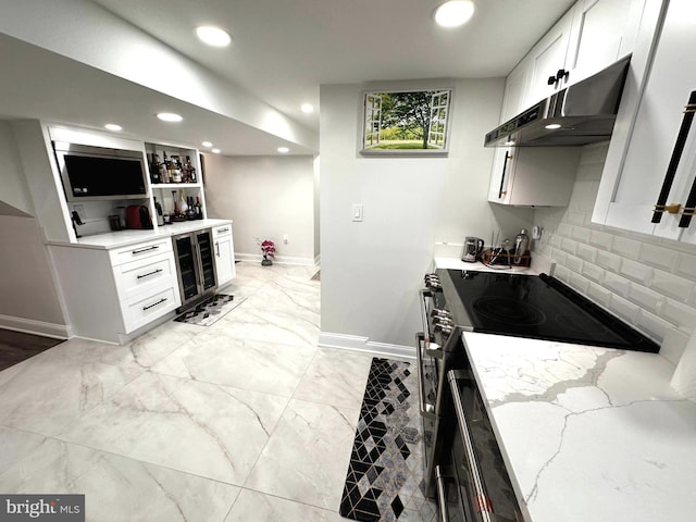 14427 Seneca Rd, Germantown, MD 20874 - kitchen featuring under cabinet range hood, wine cooler, electric range, baseboards, and recessed lighting