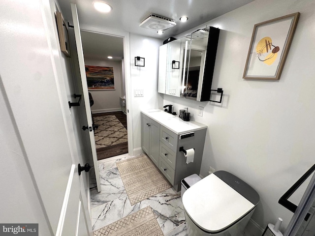 14427 Seneca Rd, Germantown, MD 20874 - bathroom featuring vanity, marble finish flooring, toilet, baseboards, and recessed lighting