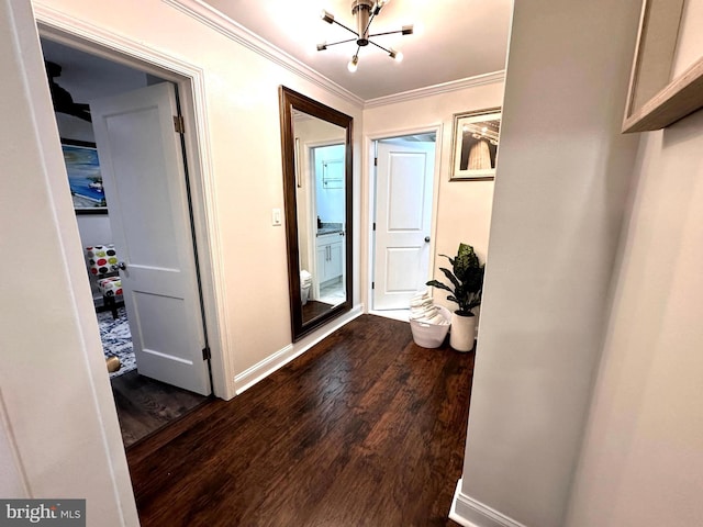 14427 Seneca Rd, Germantown, MD 20874 - hall with a chandelier, dark wood finished floors, ornamental molding, and baseboards