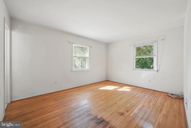 unfurnished room featuring hardwood / wood-style floors