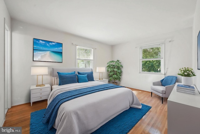 bedroom with wood finished floors