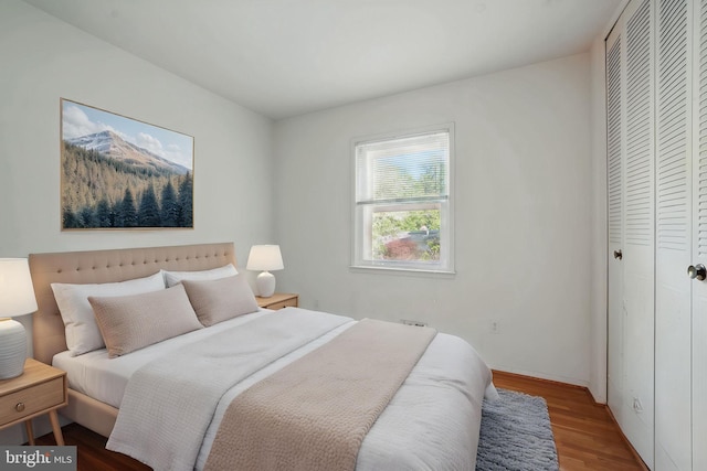 bedroom with a closet and wood finished floors