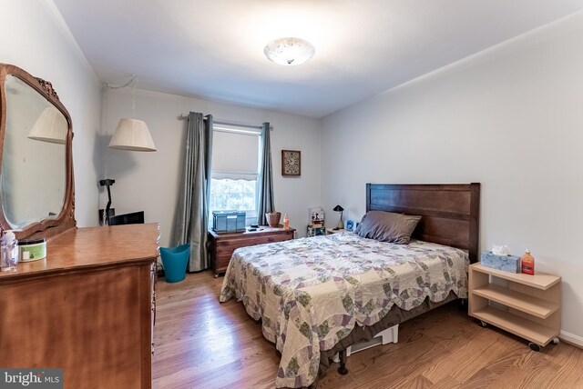 bedroom with light wood-type flooring