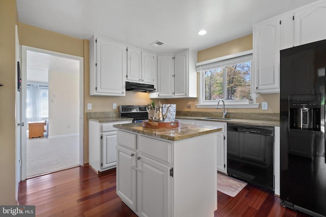 1513 Millikens Bend Rd, Herndon, VA 20170 - kitchen with black appliances, under cabinet range hood, a sink, white cabinets, and dark wood-type flooring