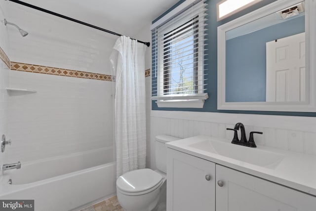 1513 Millikens Bend Rd, Herndon, VA 20170 - bathroom featuring toilet, shower / bath combination with curtain, vanity, and wainscoting