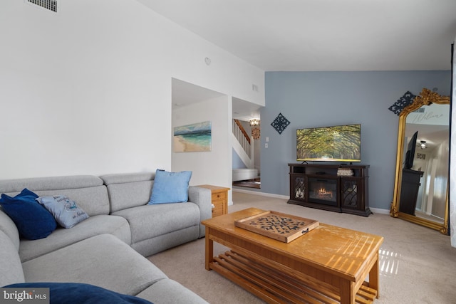 1513 Millikens Bend Rd, Herndon, VA 20170 - carpeted living room with stairs, a glass covered fireplace, and baseboards