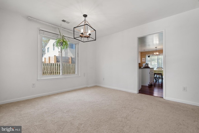 1513 Millikens Bend Rd, Herndon, VA 20170 - empty room with a chandelier, carpet flooring, and baseboards