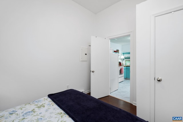 115 Circle Rd, Stanardsville, VA 22973 - bedroom featuring freestanding refrigerator, wood finished floors, and electric panel